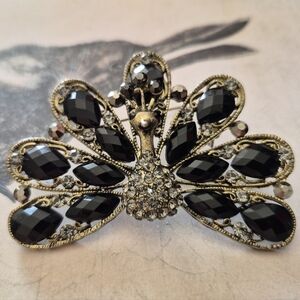 Elegant Black and Gold Peacock Brooch